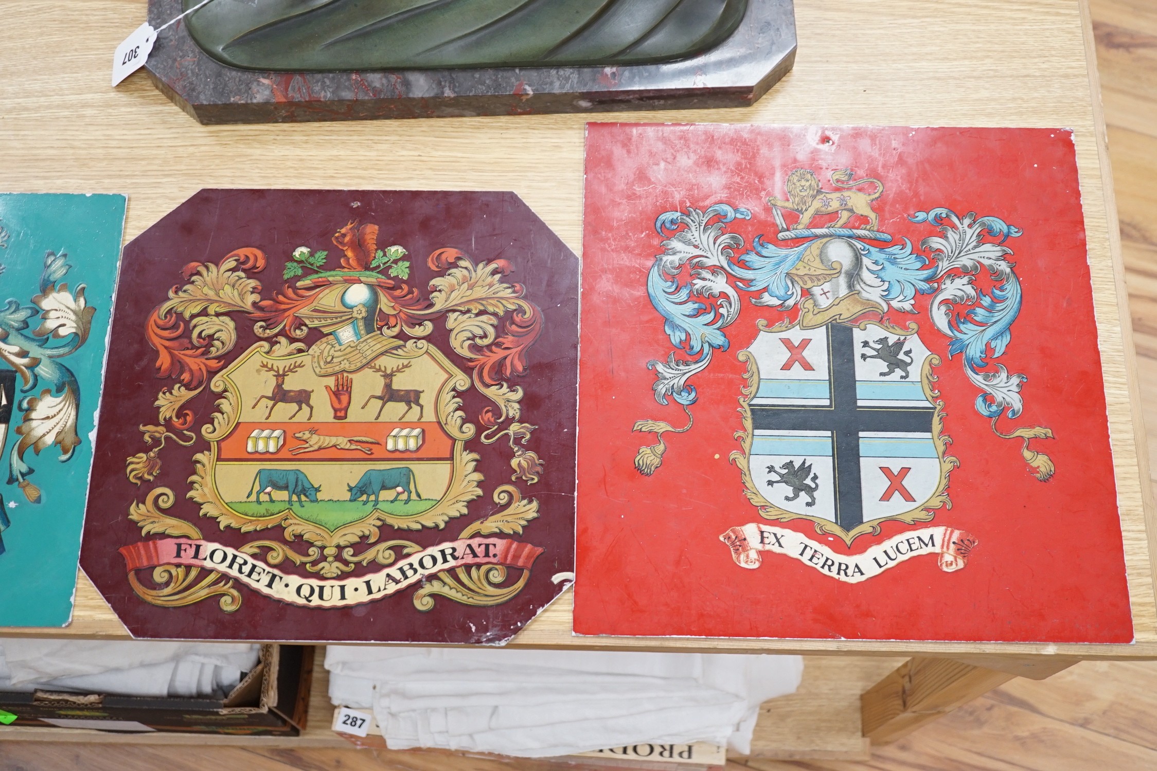 Four tin and enamel armorial signs, largest 38 cms x 36 cms